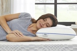 Woman laying on a Sealy Gel Pillow