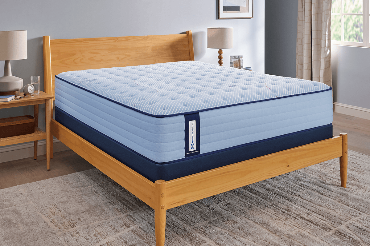 naked Posturepedic spring mattress in a styled room