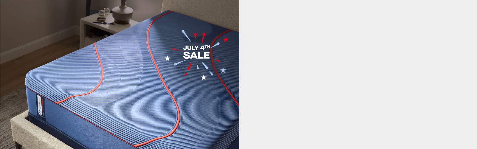 corner view of an elite mattress with "July 4th Sale" illustrated in the foreground