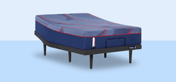Posturepedic Elite Hybrid mattress on an adjustable base with a light blue background