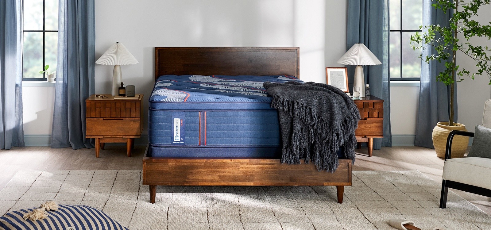 Posturepedic Elite Spring pillow top mattress in a styled room