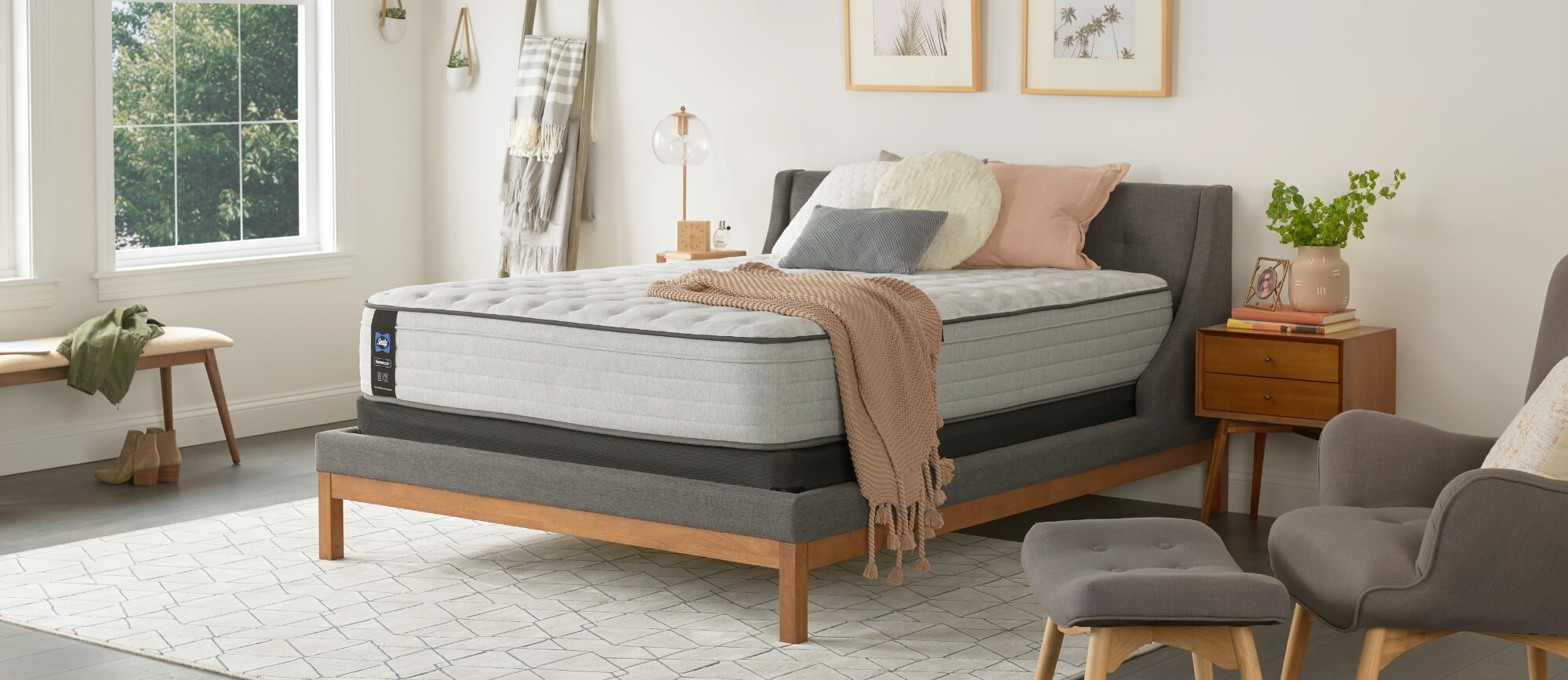 A Posturepedic mattress in a styled room