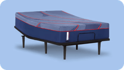 Posturepedic Elite mattress on adjustable base with blue background