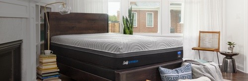 A Sealy Performance Hybrid mattress in a styled room.