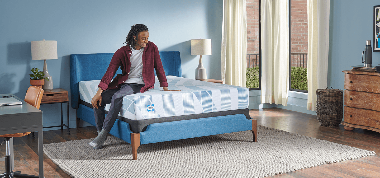 Man sitting on 10" Dreamlife mattress